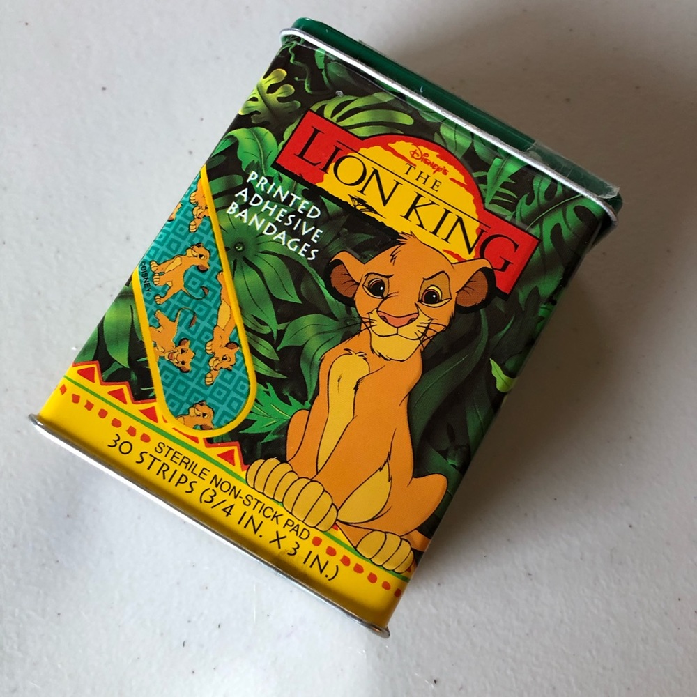 Lion King Bandaid Tin with a few bandaids